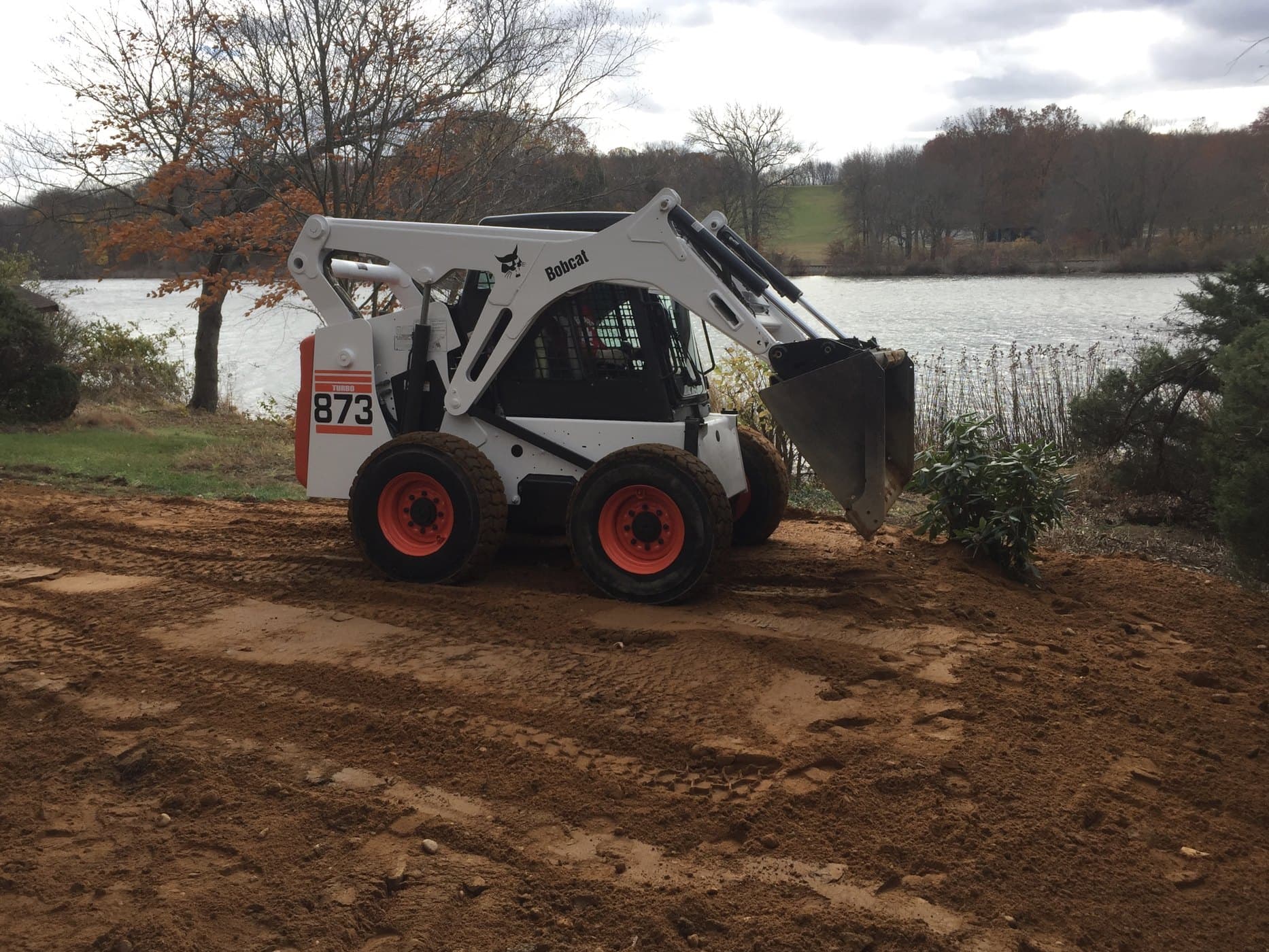 Skid-steer on a commercial grading and landscape job